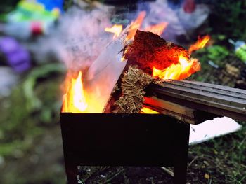 Close-up of fire burning on wood