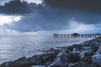 Typical old wooden fishing huts on stilts called carrelet  in the atlantic ocean