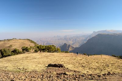 Scenic view of landscape and mountains against sky