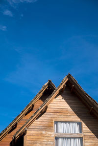 Low angle view of building against blue sky