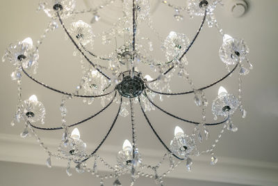 Low angle view of chandelier hanging on ceiling