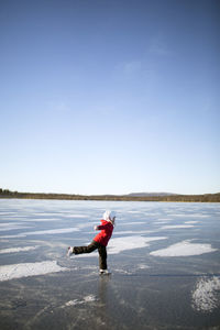 Girl on frozen lake