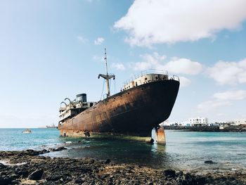 Old rusty ship stranded on the seashore