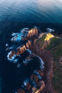 Aerial view of rock formations on coastline