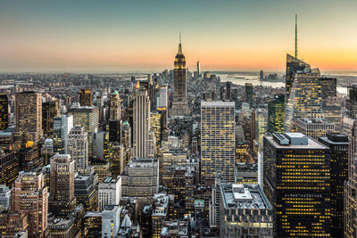 Aerial view of city buildings during sunset