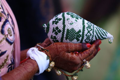 Close-up of man holding hands