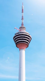 Low angle view of kl tower against clear blue sky