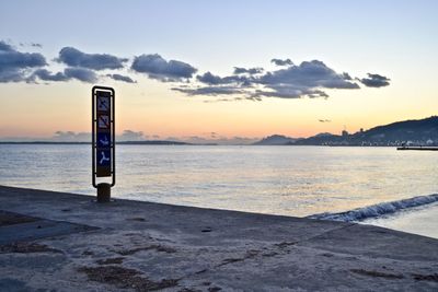 Scenic view of beach against sky during sunset