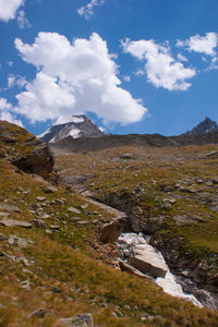 View of landscape against cloudy sky