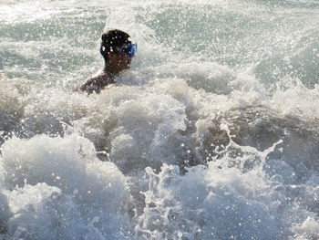 Man swimming in sea