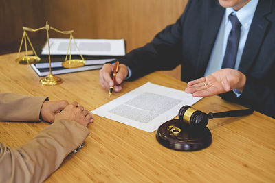 High angle view of client with lawyer