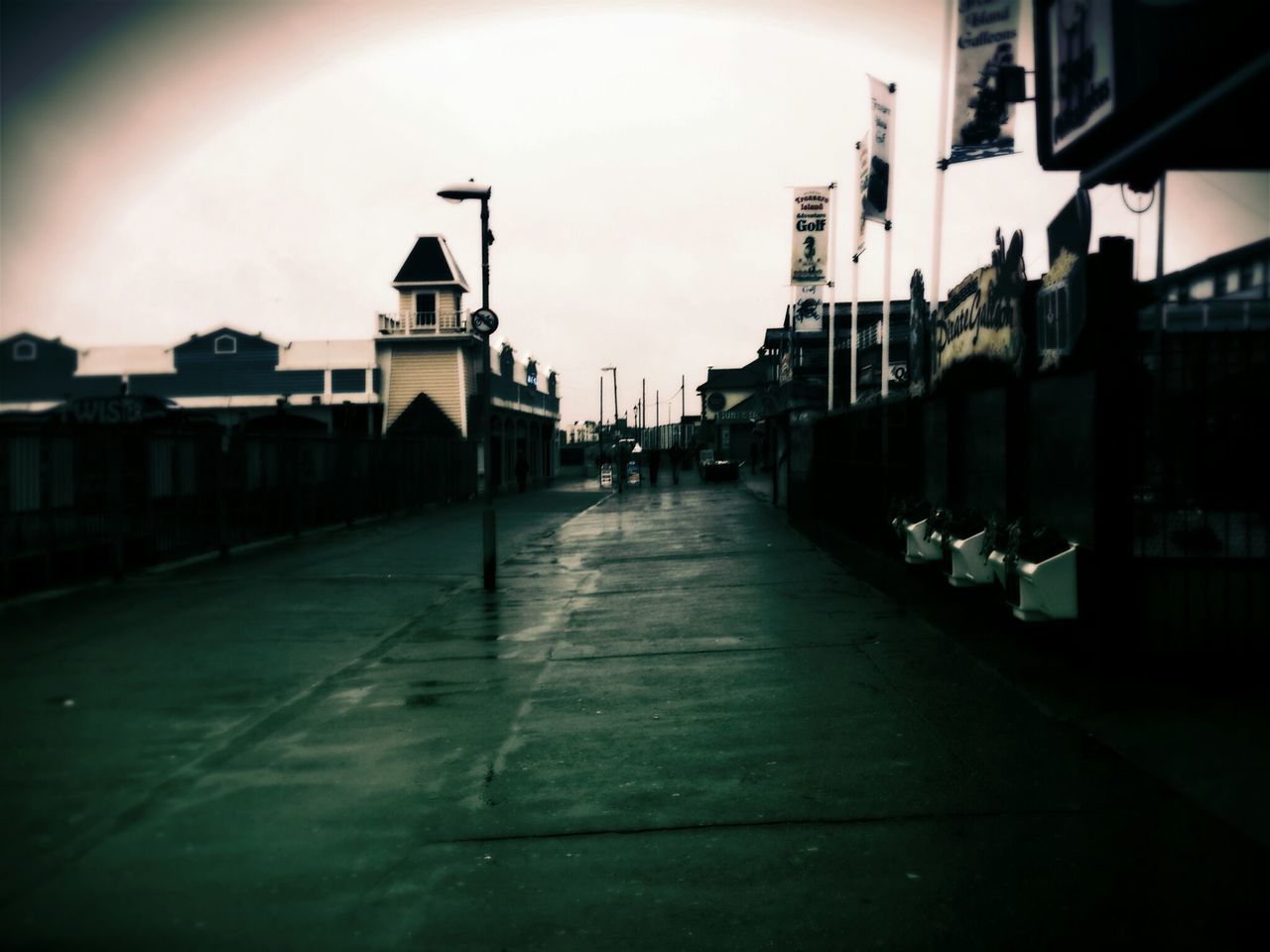 building exterior, architecture, built structure, city, the way forward, street, transportation, transfer print, sky, auto post production filter, diminishing perspective, building, residential structure, residential building, incidental people, in a row, empty, road, outdoors, street light