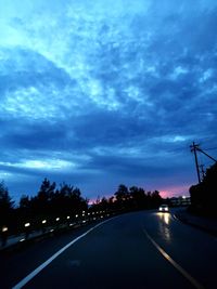 Road against cloudy sky