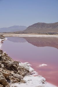 Scenic view of red lake against sky