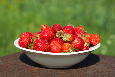 Close-up of strawberries in bowl on table