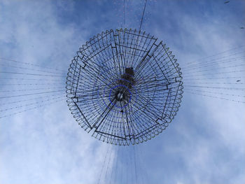 Low angle view of ferris wheel against sky