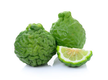 Close-up of fruits against white background