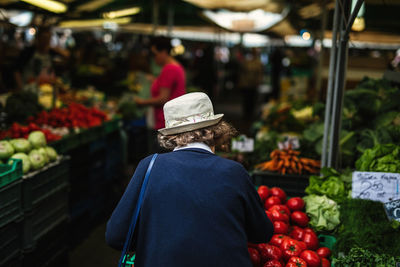 Rear view of woman at market