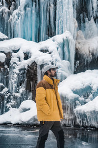 Full length of woman standing on snow