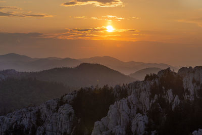 Scenic view of mountains against sky during sunset