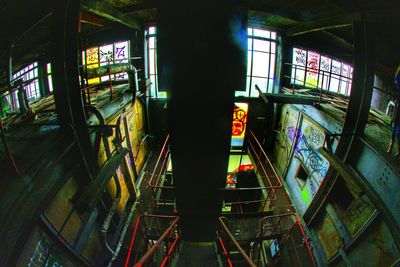 Man on illuminated underground walkway