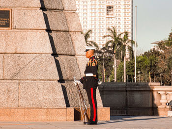 Full length rear view of man walking in city