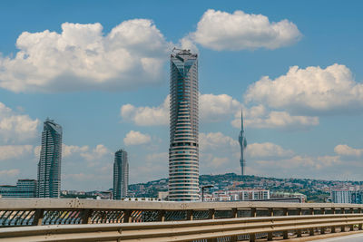 Modern buildings in city against sky