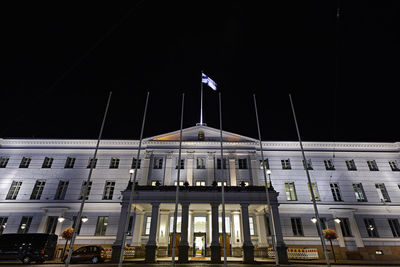 Low angle view of building against clear sky at night