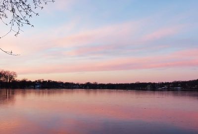 Scenic view of lake at sunset