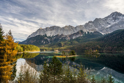 Scenic view of lake and mountains against sky