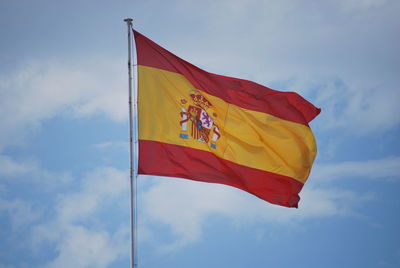 Low angle view of flag against sky