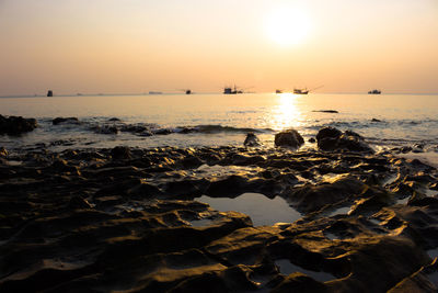 Scenic view of sea against sky during sunset