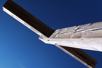 Low angle view of built structure against clear blue sky