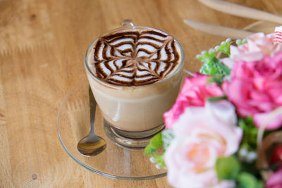 High angle view of cappuccino served on table