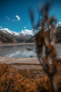 Scenic view of lake against sky during winter