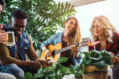 Young woman playing guitar