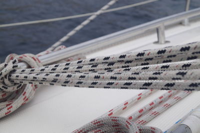 High angle view of ropes tied up to boat on sea