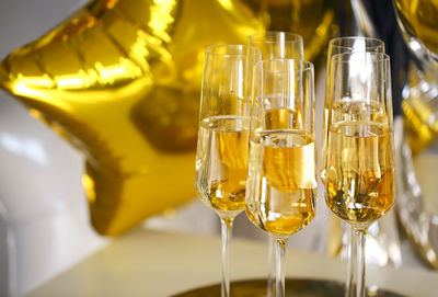 Close-up of wine glass bottles on table