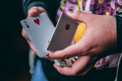 Midsection of man holding hands