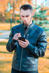 Young man using mobile phone