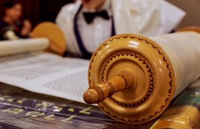 Close-up of old traditional scroll on table