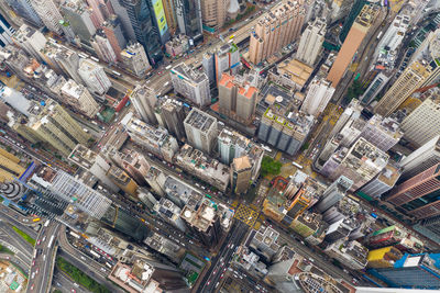 High angle view of illuminated street amidst buildings in city