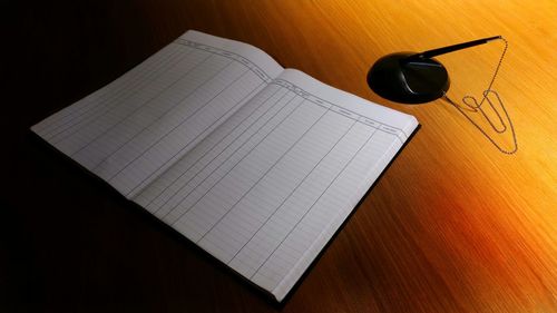 High angle view of open book on table