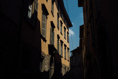 Low angle view of buildings against sky in city