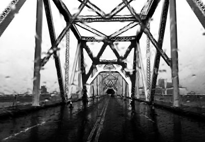 Bridge in city against sky