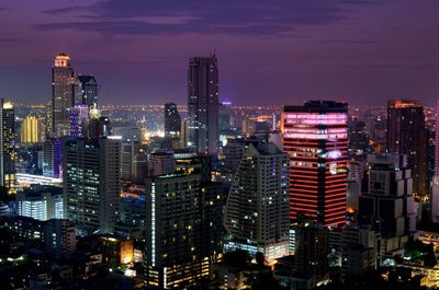 High angle view of city lit up at night