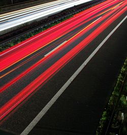 High angle view of light trails on road at night