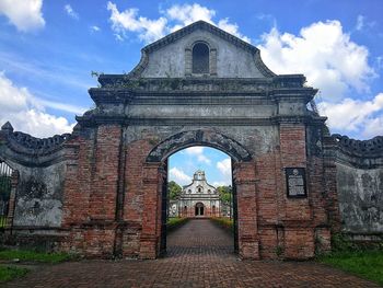 View of historic building against cloudy sky