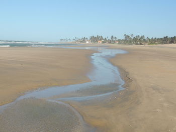 Scenic view of beach against clear sky