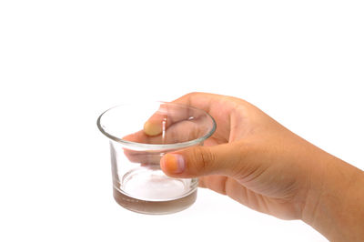 Close-up of hands working in water